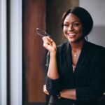 african american business woman by window 1303 10869